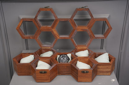 Wooden honeycomb structure with hexagonal compartments on a gray background