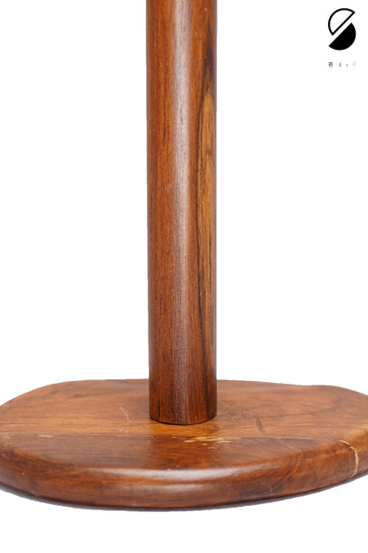 Wooden stand with a round base and cylindrical column on a white background