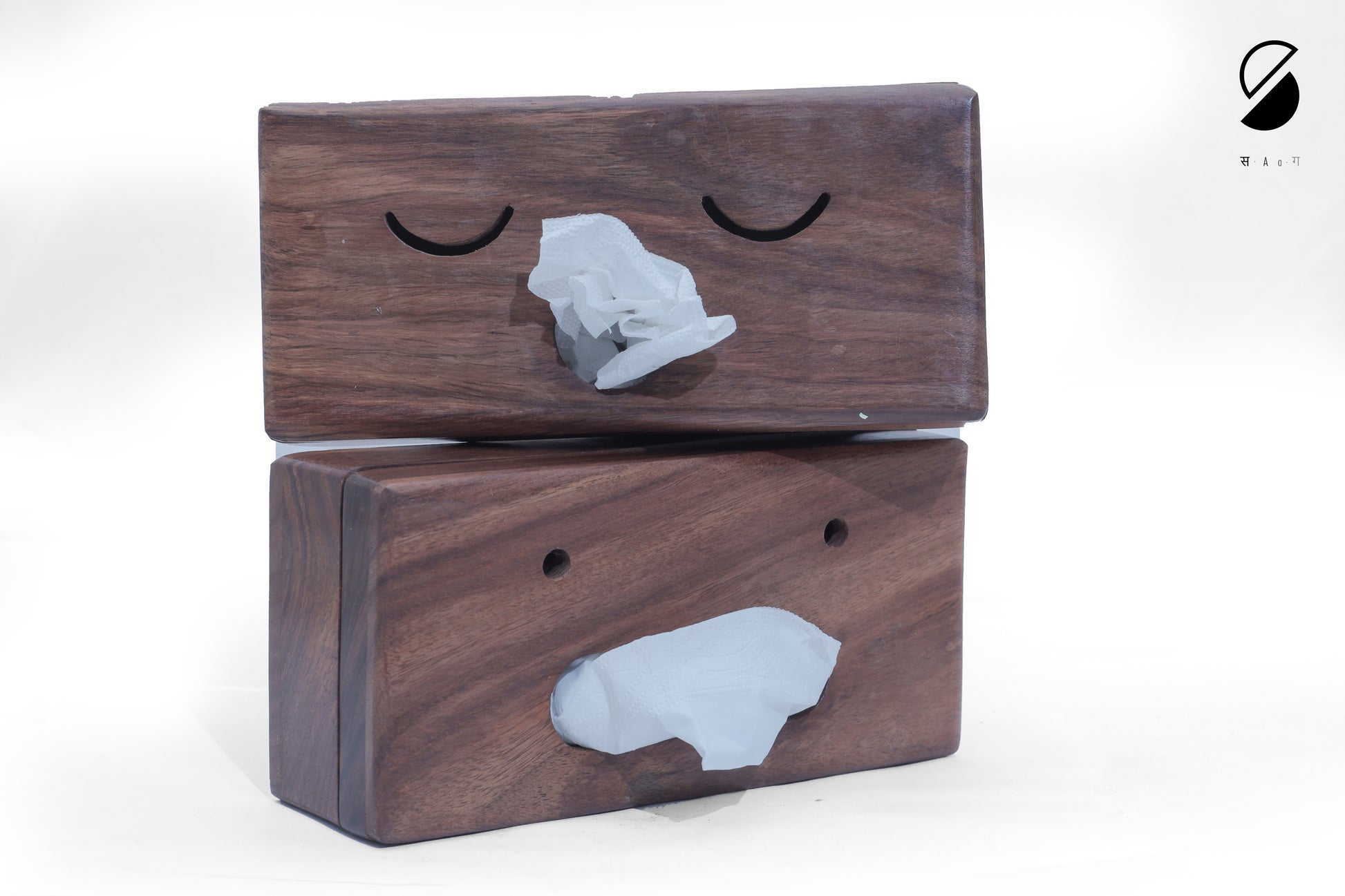 Two wooden blocks with gray stone-like figures on a white background