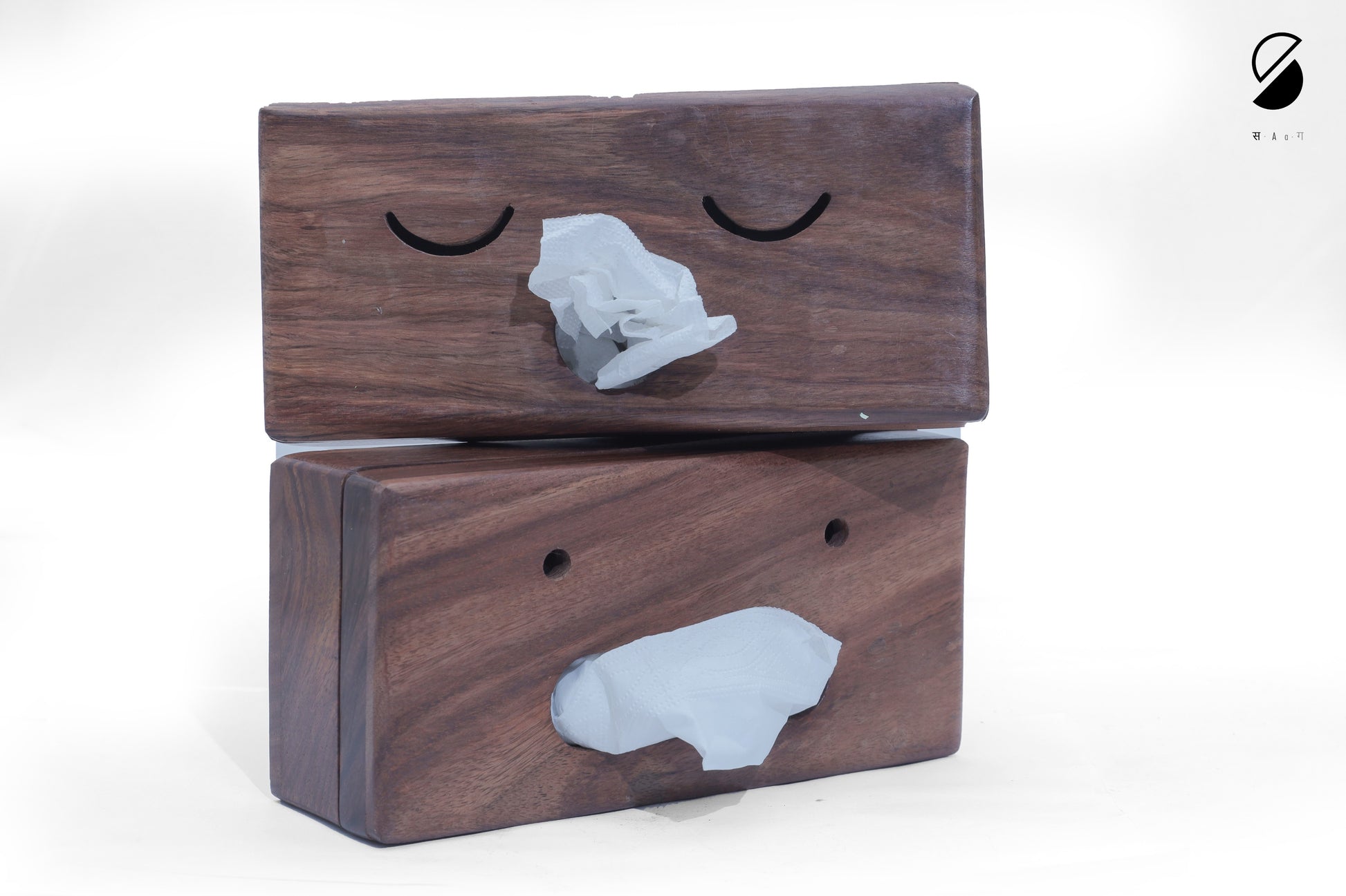 Two wooden blocks with gray stone-like figures on a white background