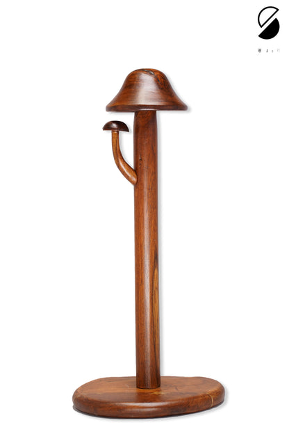 Wooden hat stand with a hat on a white background